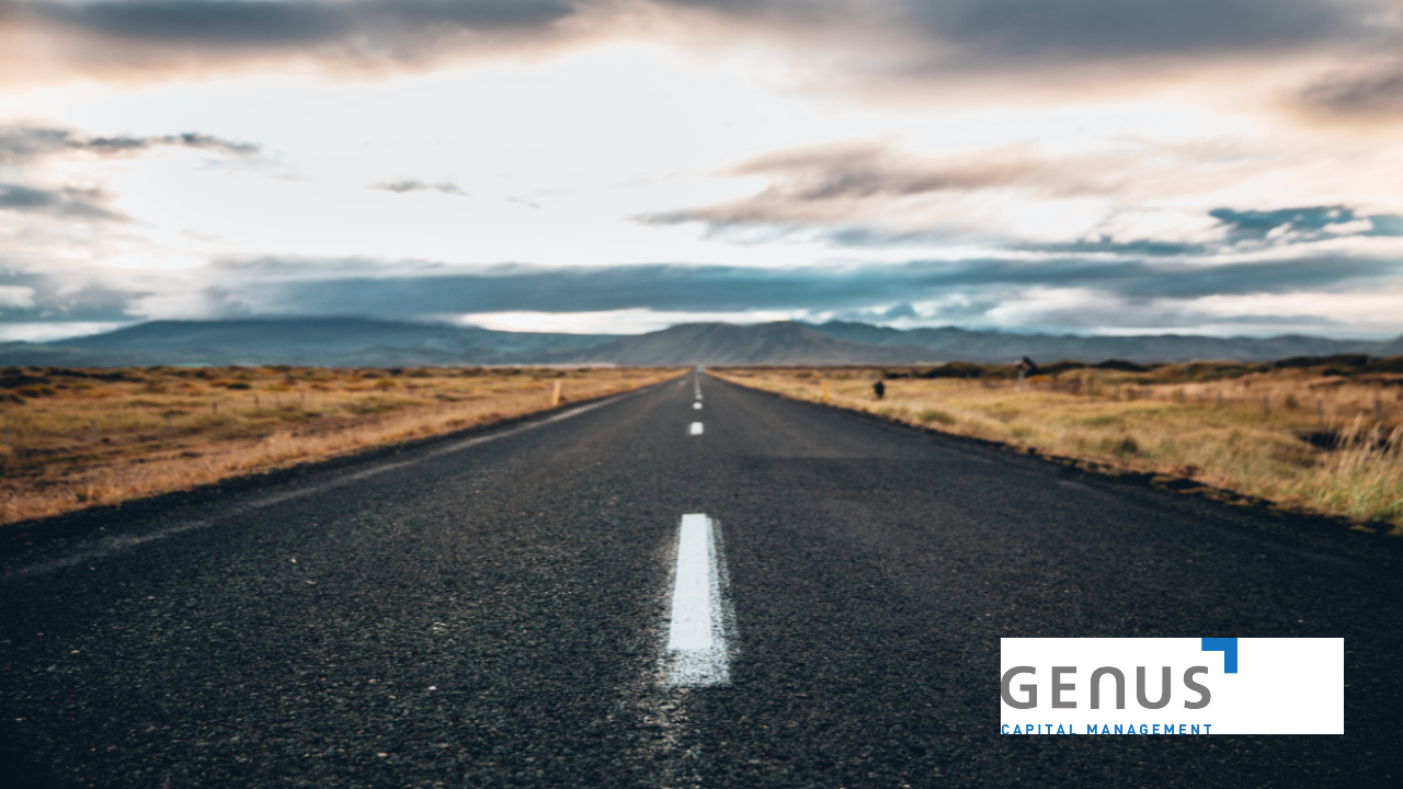 image of a road with vegetation on the sides, logo of genus capital management on the bottom right