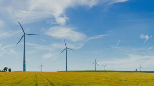 windmill farm with a blue sky background