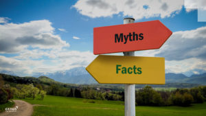 Blue sky and green grass with two arrows pointing to opposite directions: yellow arrow pointing left saying "Facts" in green and red arrow pointing right saying "Myths" in black