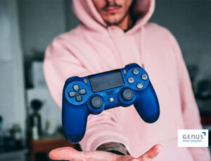 man with pink hoodie holding a blue videogame control