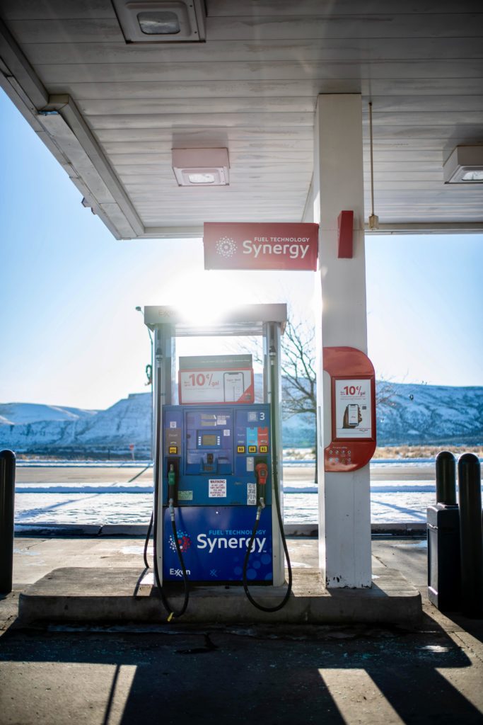 Gas pump in front of snowed mountain