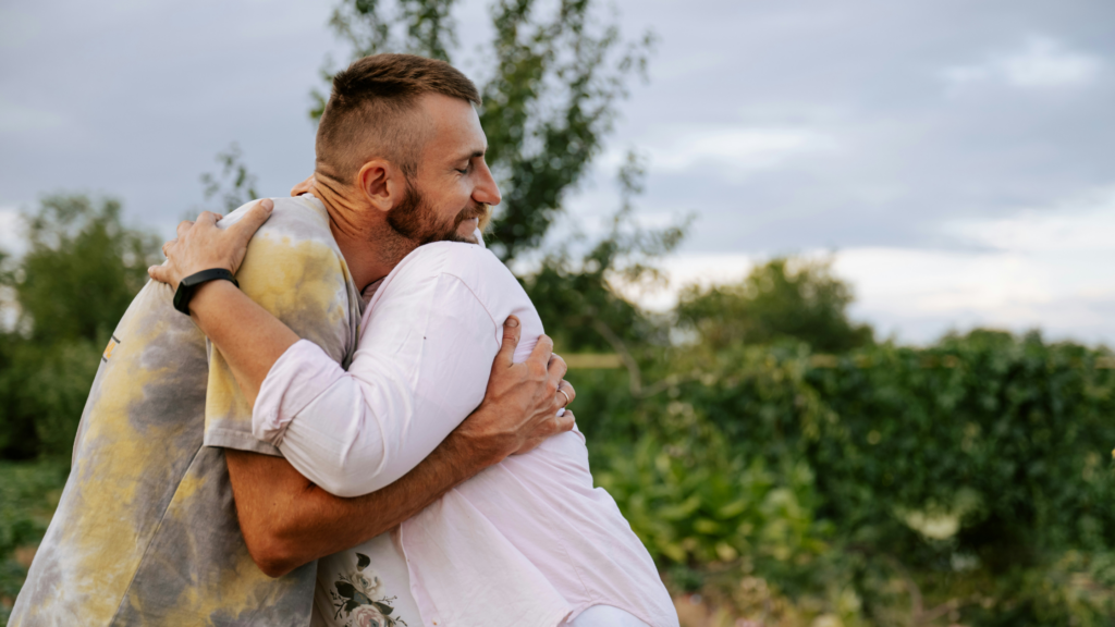 parent and son hugging